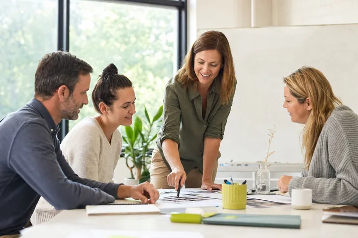 Independent educator leading a practical small-group workshop